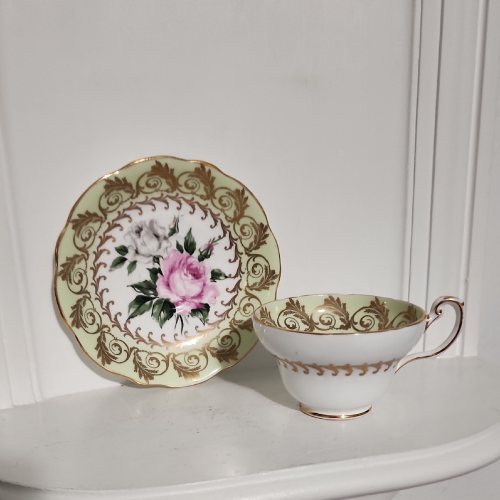 This is a vintage EB Foley bone china teacup and saucer set in the 'Cabbage Rose